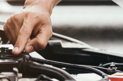 Technician inspecting vehicle frame at Heart City Toyota Collision Center in Elkhart, IN